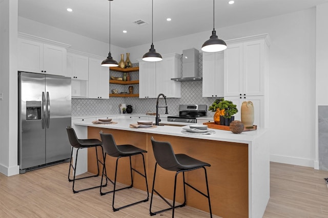 825 Rd 5501, Cleveland, TX 77327 - kitchen with stainless steel appliances, wall chimney range hood, open shelves, light countertops, and backsplash