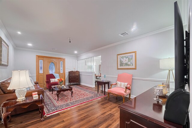 7833 Narcissus St, Houston, TX 77012 - living area featuring wood finished floors, crown molding, and recessed lighting