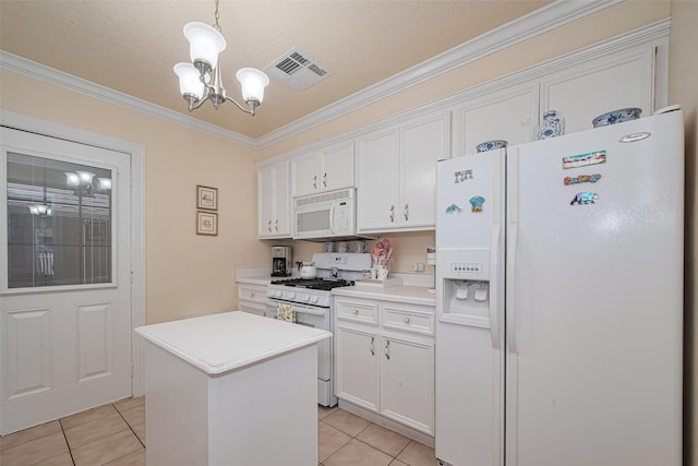 7833 Narcissus St, Houston, TX 77012 - kitchen featuring white appliances, a chandelier, light tile patterned floors, white cabinets, and ornamental molding