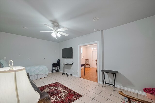 7833 Narcissus St, Houston, TX 77012 - bedroom with light tile patterned flooring and ceiling fan