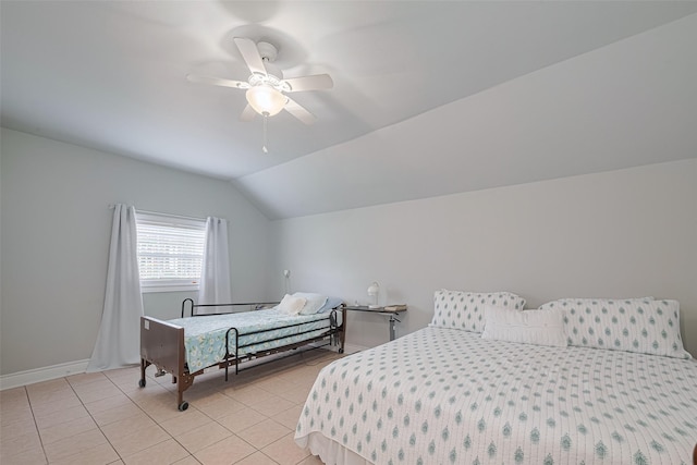 7833 Narcissus St, Houston, TX 77012 - bedroom with light tile patterned floors, vaulted ceiling, and a ceiling fan