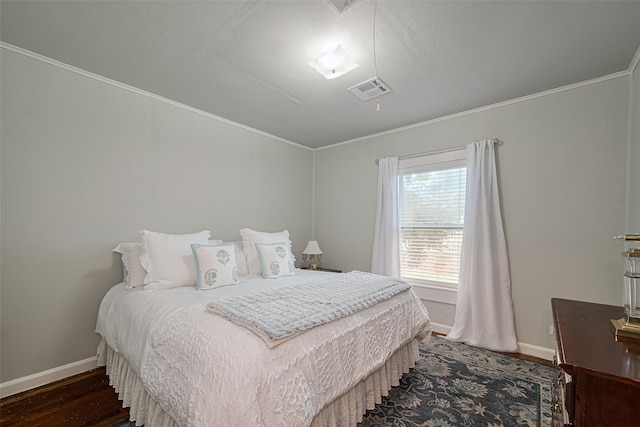 7833 Narcissus St, Houston, TX 77012 - bedroom featuring wood finished floors and ornamental molding