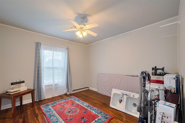7833 Narcissus St, Houston, TX 77012 - miscellaneous room featuring a ceiling fan, wood finished floors, and ornamental molding