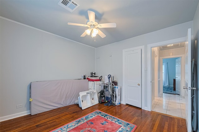 7833 Narcissus St, Houston, TX 77012 - game room with a ceiling fan and wood finished floors
