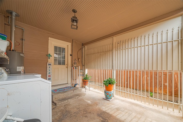 7833 Narcissus St, Houston, TX 77012 - view of exterior entry with water heater and washing machine and dryer