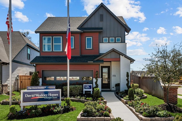10502 William Park Dr, Missouri City, TX 77459 - view of front of house featuring board and batten siding, a shingled roof, brick siding, and an attached garage