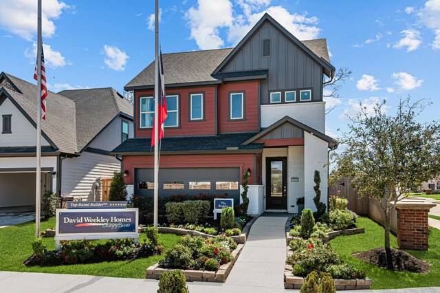 10502 William Park Dr, Missouri City, TX 77459 - view of front of house featuring board and batten siding, a shingled roof, and an attached garage
