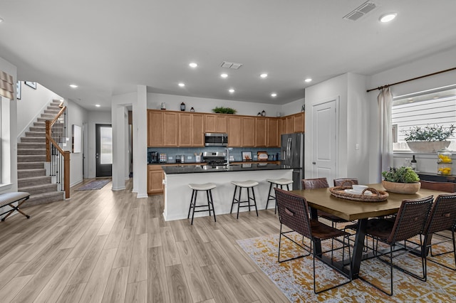 10502 William Park Dr, Missouri City, TX 77459 - dining space with stairway, recessed lighting, and light wood-style floors