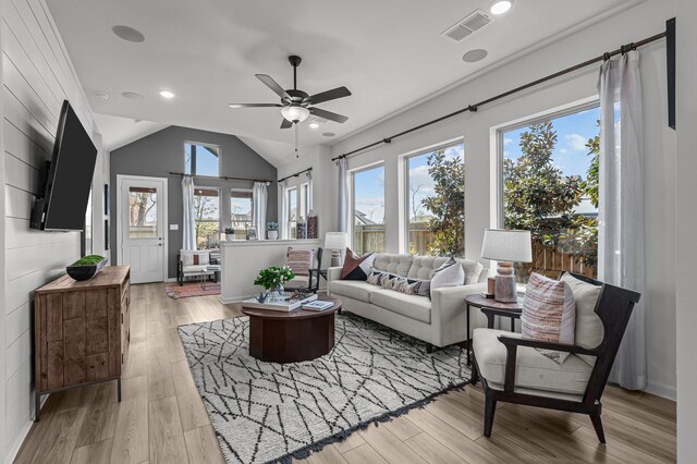 10502 William Park Dr, Missouri City, TX 77459 - living area featuring ceiling fan, light wood-style floors, vaulted ceiling, and recessed lighting