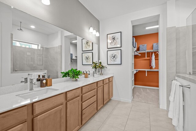 10502 William Park Dr, Missouri City, TX 77459 - bathroom featuring double vanity, walk in shower, tile patterned floors, and a spacious closet