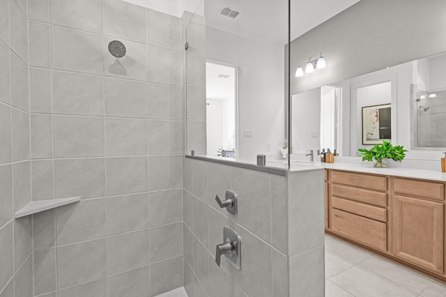 10502 William Park Dr, Missouri City, TX 77459 - bathroom with a tile shower, vanity, and tile patterned floors