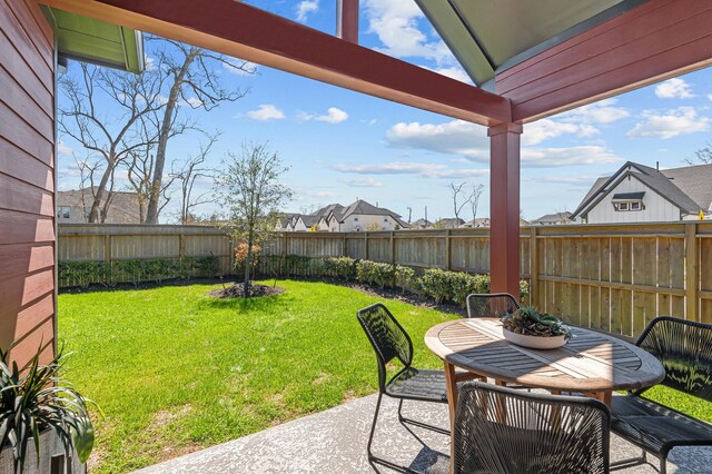 10502 William Park Dr, Missouri City, TX 77459 - fenced backyard with a patio and outdoor dining area