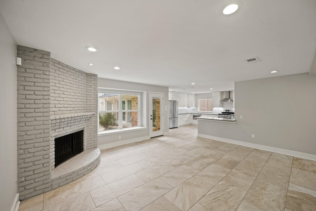 5135 Loch Lomond Dr, Houston, TX 77096 - unfurnished living room with recessed lighting and a fireplace
