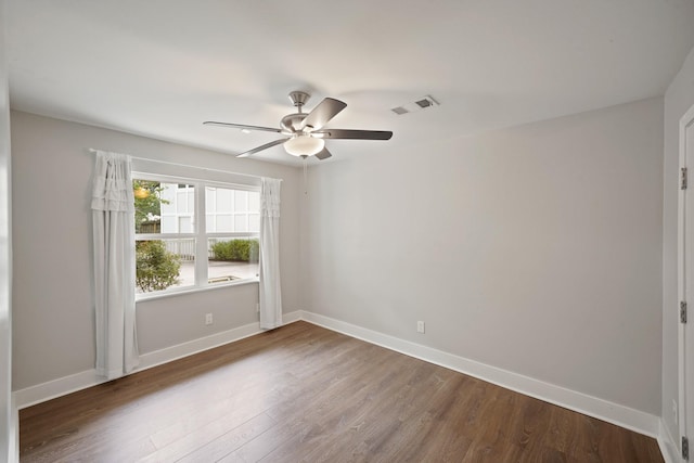5135 Loch Lomond Dr, Houston, TX 77096 - empty room featuring dark wood-style flooring and a ceiling fan