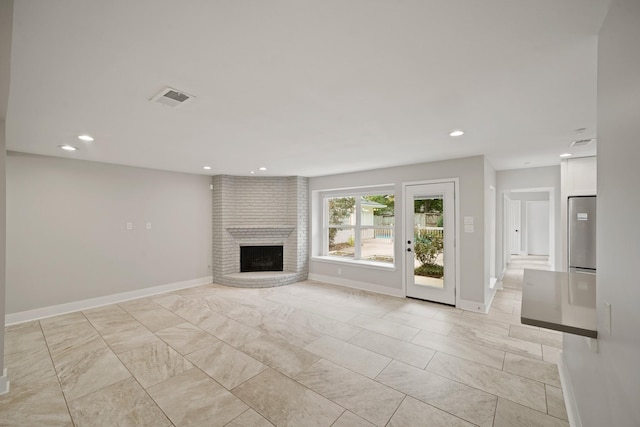 5135 Loch Lomond Dr, Houston, TX 77096 - unfurnished living room with a brick fireplace and recessed lighting