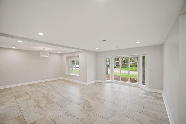 5135 Loch Lomond Dr, Houston, TX 77096 - empty room with recessed lighting, a chandelier, and light marble finish floors