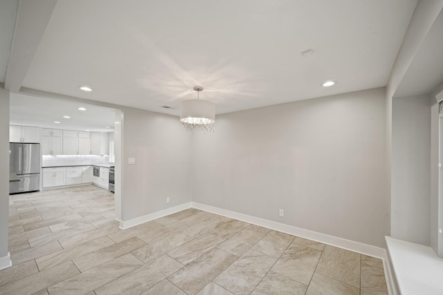 5135 Loch Lomond Dr, Houston, TX 77096 - empty room with recessed lighting and a chandelier