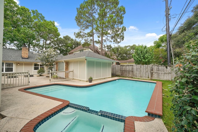 5135 Loch Lomond Dr, Houston, TX 77096 - view of swimming pool with a pool with connected hot tub, a fenced backyard, and a patio