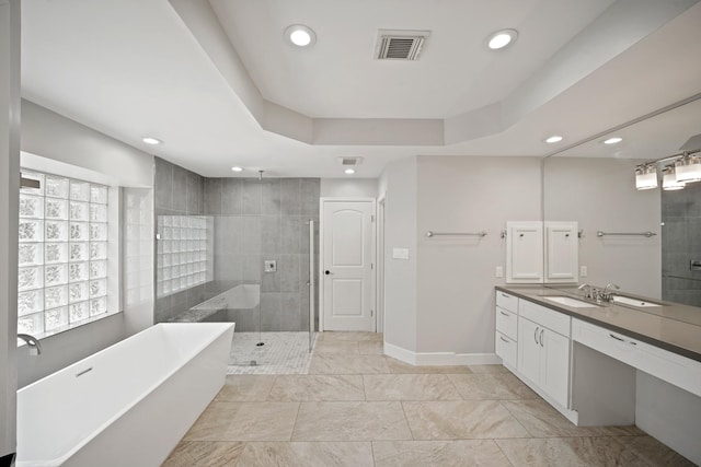 5135 Loch Lomond Dr, Houston, TX 77096 - bathroom featuring a shower stall, vanity, a soaking tub, and recessed lighting