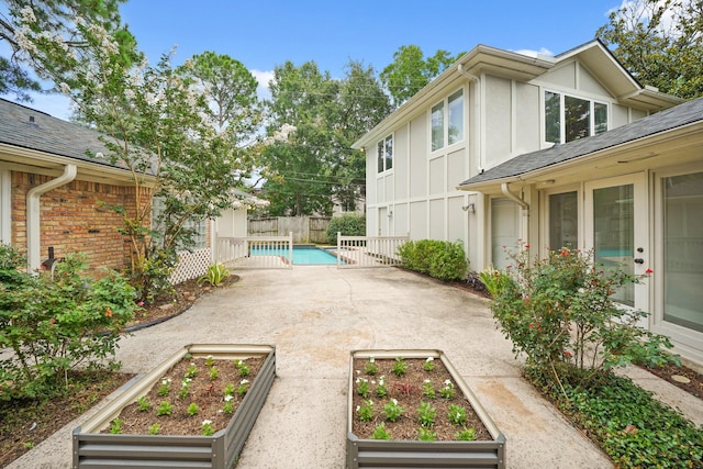 5135 Loch Lomond Dr, Houston, TX 77096 - view of yard featuring a garden and a patio area