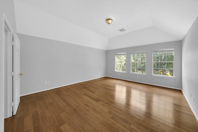13810 Lakewood Crossing Blvd, Houston, TX 77070 - spare room featuring vaulted ceiling and wood finished floors
