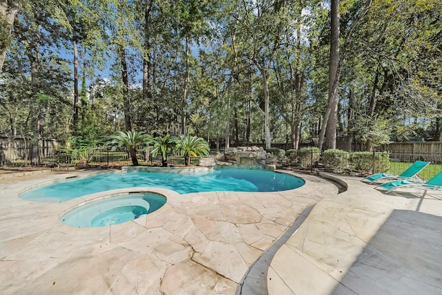 13810 Lakewood Crossing Blvd, Houston, TX 77070 - view of pool with an in-ground hot tub, a fenced backyard, a patio, and view of wooded area