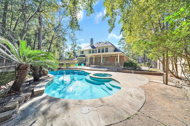 13810 Lakewood Crossing Blvd, Houston, TX 77070 - view of pool with a patio area, a pool with connected hot tub, and a fenced backyard