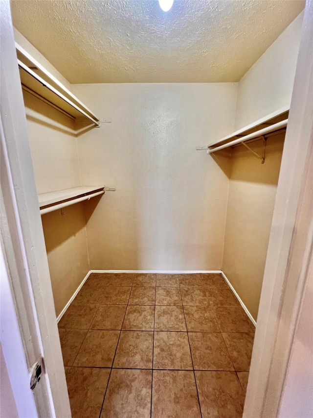 14634 Edenglen Dr, Houston, TX 77049 - walk in closet with tile patterned flooring