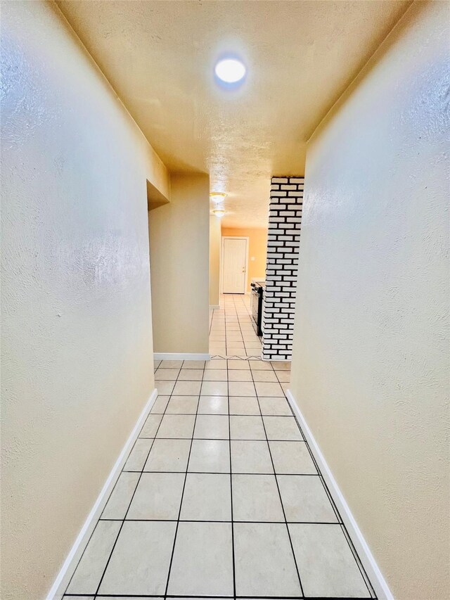14634 Edenglen Dr, Houston, TX 77049 - hall featuring light tile patterned floors and baseboards