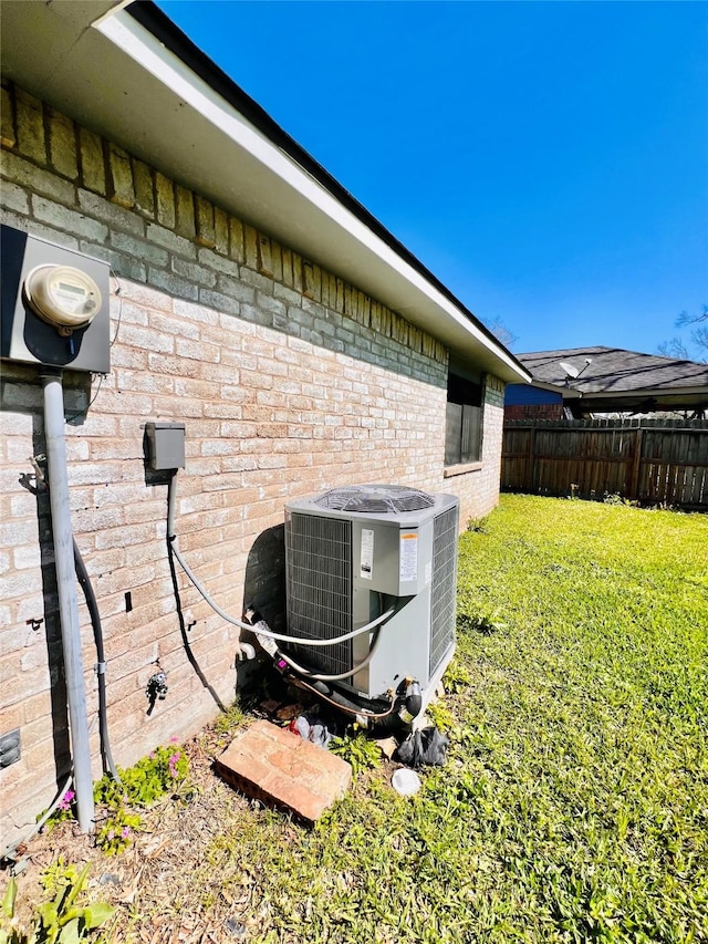 14634 Edenglen Dr, Houston, TX 77049 - exterior view of a cooling unit and brick siding