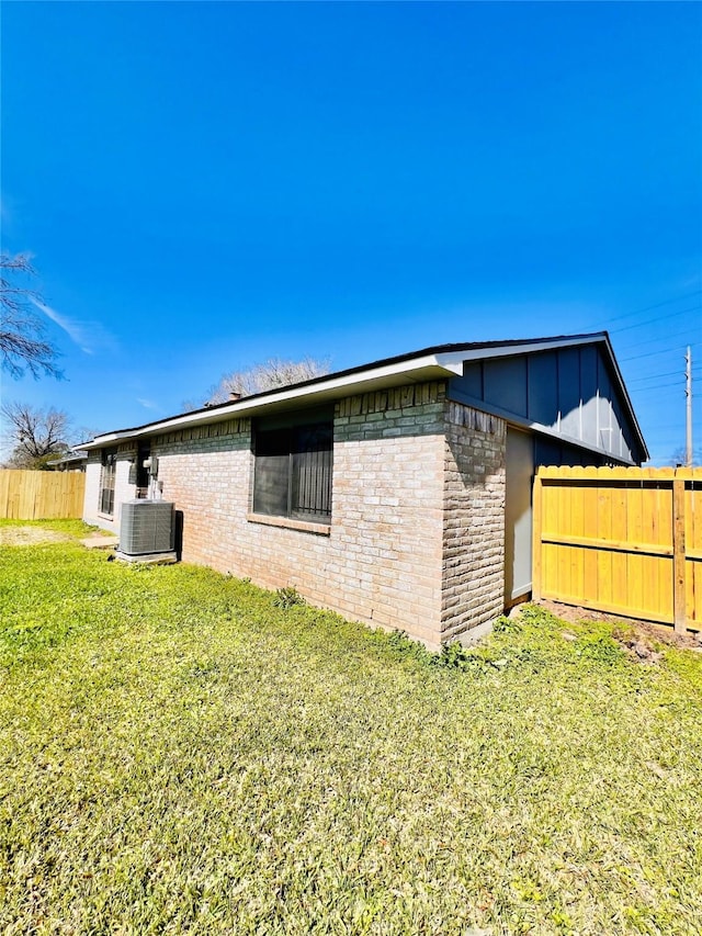 14634 Edenglen Dr, Houston, TX 77049 - view of side of home featuring board and batten siding and brick siding