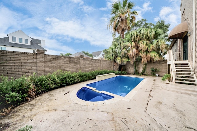 1425 Nantucket Dr Unit G, Houston, TX 77057 - view of swimming pool with a fenced backyard, a pool with connected hot tub, and a patio area