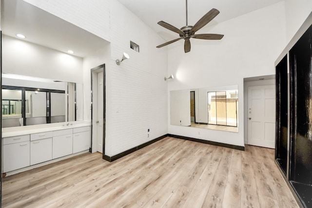 1425 Nantucket Dr Unit G, Houston, TX 77057 - unfurnished bedroom featuring high vaulted ceiling and light wood-style flooring