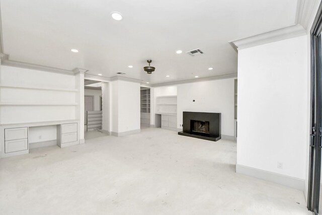1425 Nantucket Dr Unit G, Houston, TX 77057 - unfurnished living room with a fireplace with raised hearth, stairs, recessed lighting, built in features, and a desk