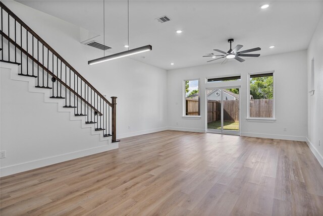4517 Teton St, Houston, TX 77051 - unfurnished living room with a ceiling fan, light wood finished floors, stairs, and recessed lighting
