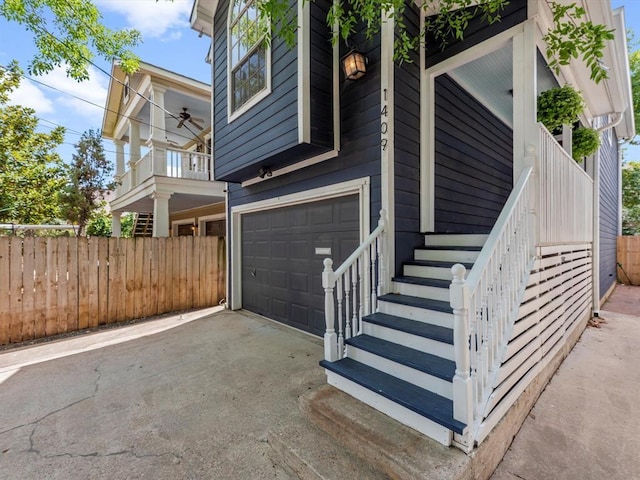 1409 Blair St, Houston, TX 77008 - view of side of home with an attached garage, driveway, and stairs