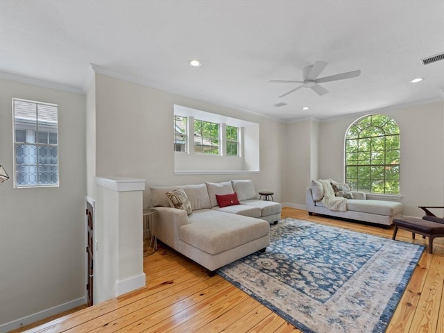 1409 Blair St, Houston, TX 77008 - living room featuring crown molding, light wood-type flooring, ceiling fan, and recessed lighting