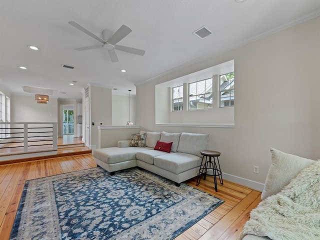 1409 Blair St, Houston, TX 77008 - living room featuring plenty of natural light, wood-type flooring, a ceiling fan, crown molding, and recessed lighting