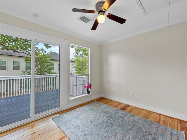 1409 Blair St, Houston, TX 77008 - unfurnished room with a ceiling fan, crown molding, hardwood / wood-style floors, and attic access