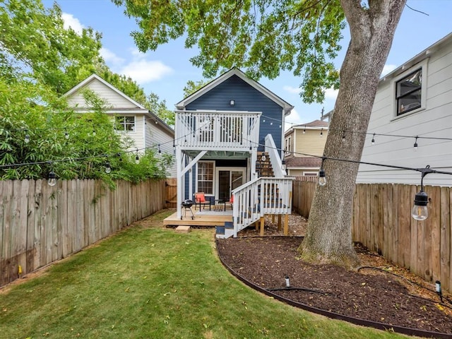 1409 Blair St, Houston, TX 77008 - back of house with a deck, a fenced backyard, and stairway