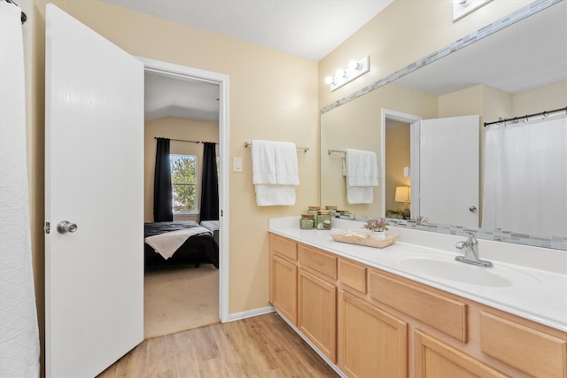 15026 Sunset Creek Dr, Humble, TX 77396 - ensuite bathroom featuring wood finished floors and vanity