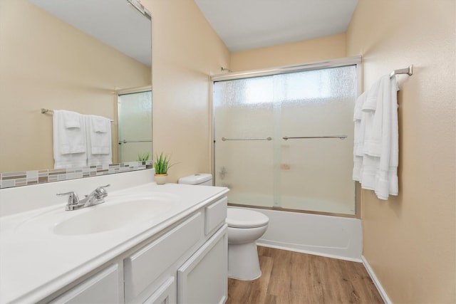 15026 Sunset Creek Dr, Humble, TX 77396 - bathroom with vanity, wood finished floors, and combined bath / shower with glass door