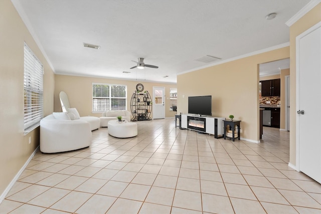 15026 Sunset Creek Dr, Humble, TX 77396 - living room featuring ceiling fan, crown molding, and light tile patterned flooring