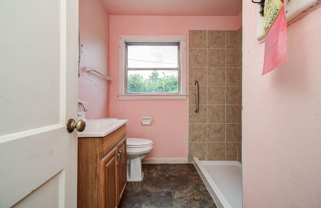 4310 Busiek St, Houston, TX 77022 - bathroom with vanity, a stall shower, and stone finish flooring