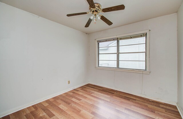 4310 Busiek St, Houston, TX 77022 - spare room featuring light wood-type flooring and ceiling fan