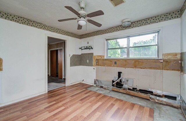 4310 Busiek St, Houston, TX 77022 - spare room featuring a textured ceiling, light wood-type flooring, and ceiling fan