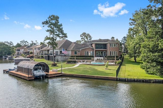 6051 Longmire Trl, Conroe, TX 77304 - dock area with a water view and a lawn