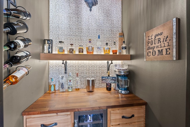 6051 Longmire Trl, Conroe, TX 77304 - indoor dry bar featuring wine cooler and decorative backsplash
