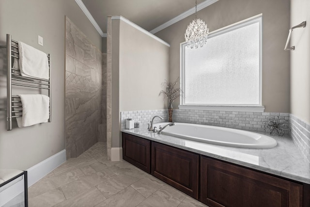6051 Longmire Trl, Conroe, TX 77304 - bathroom with a towel warmer, a garden tub, a walk in shower, a chandelier, and crown molding
