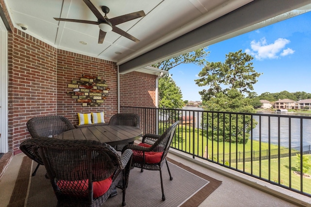 6051 Longmire Trl, Conroe, TX 77304 - balcony with ceiling fan, a water view, and outdoor dining space